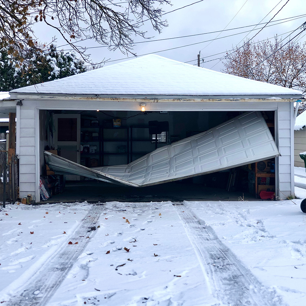 Broken garage door needing repairs